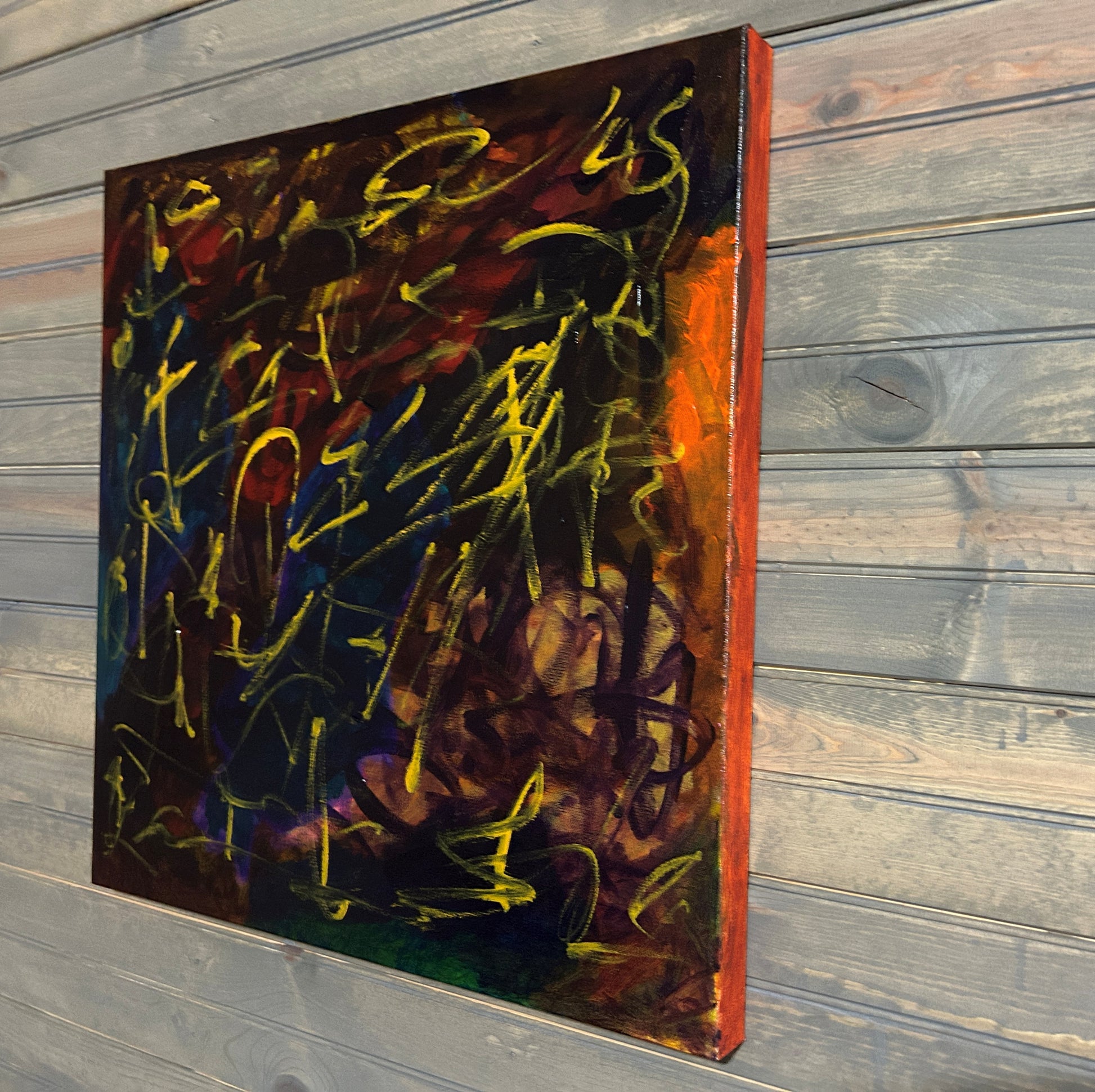Abstract painting with vibrant colors on a wooden panel